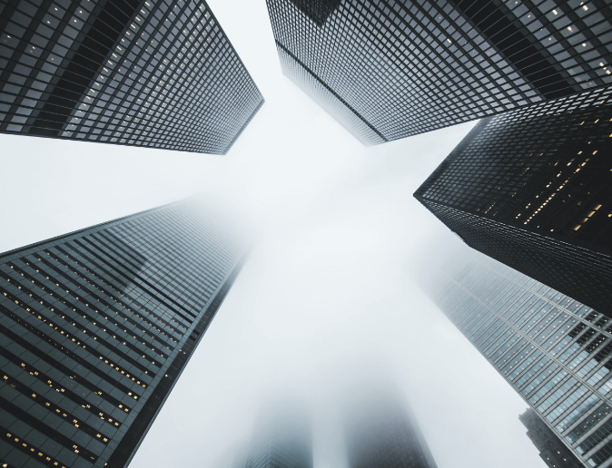 Skyscrapers rising into the misty sky.